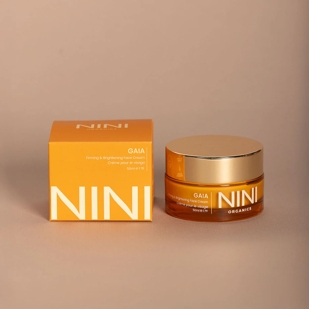 NINI skincare gaia face cream product jar and box on a beige background