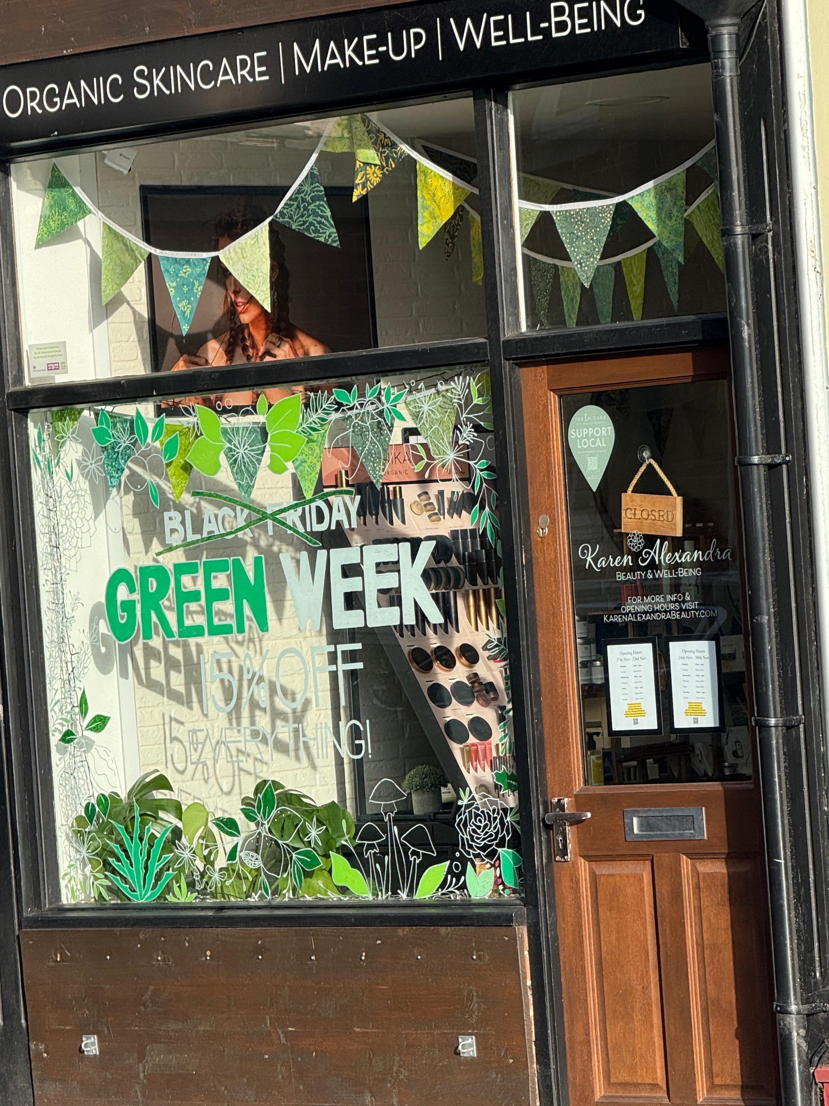 Storefront with 'Green Week' display and wooden door AT KAREN ALEXANDRA BEAUTY AND WELLBEING TONBRIDGE