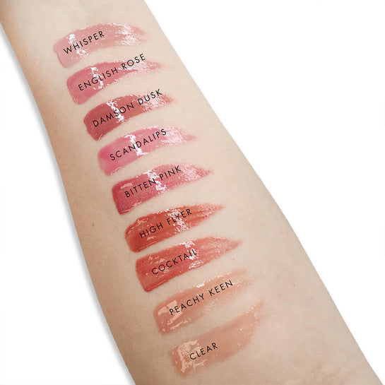 Lily Lolo Natural Lip Gloss collection and swatches on an arm to display the stunning colours