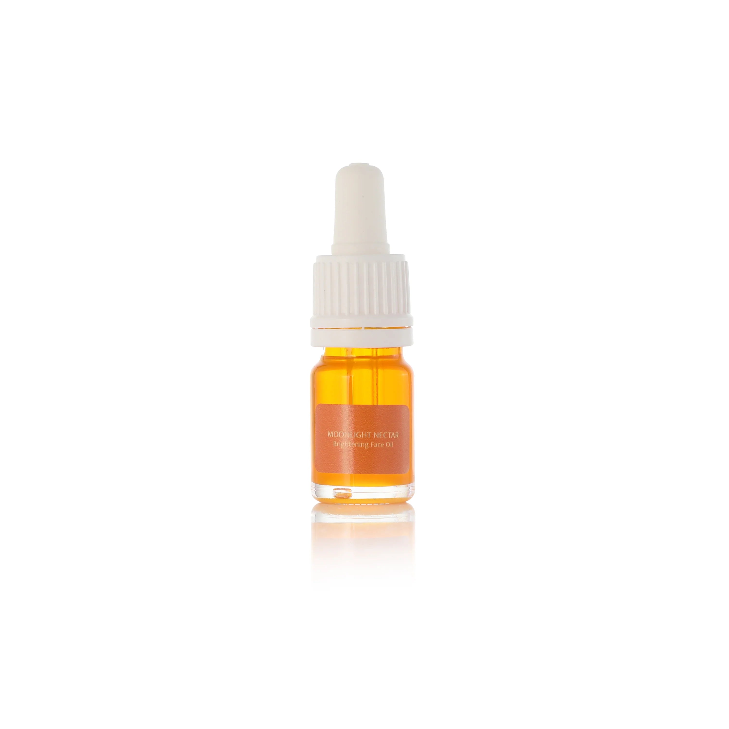 NINI Organics Moonlight nectar travel size Small dropper bottle with orange liquid on a white background