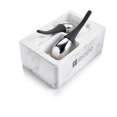 Set of silver cryo thermal sculpting spoons with black handles in a white box on a white background