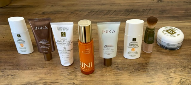 Collection of skincare products on a wooden surface