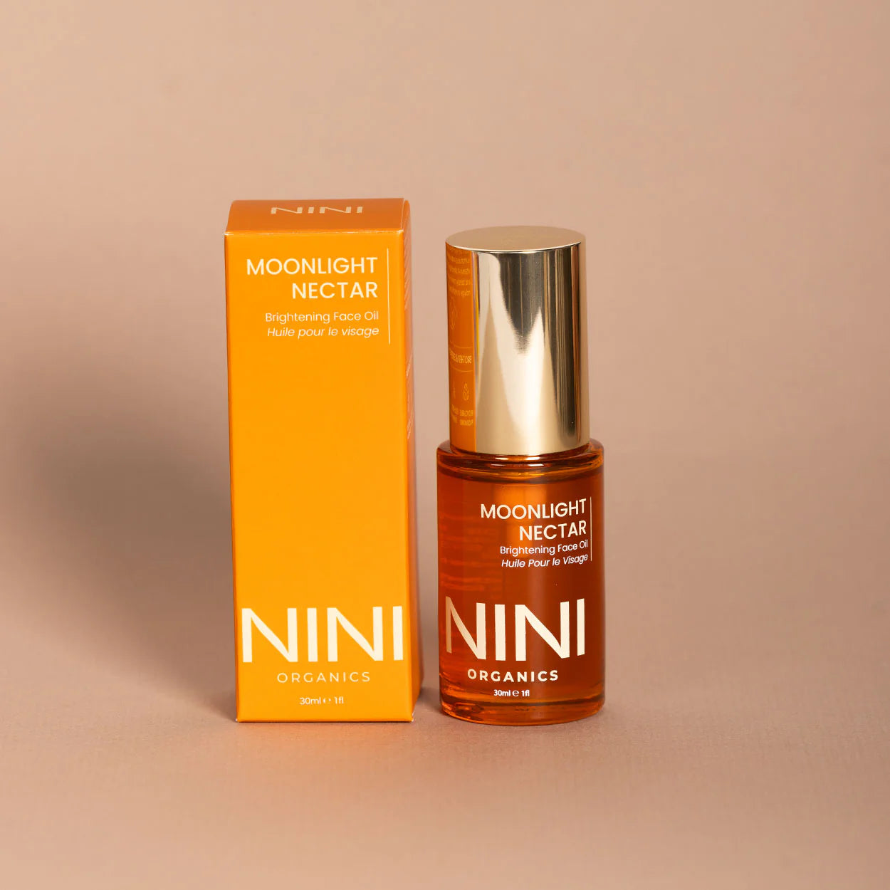 NINI Organics Moonlight Nectar facial oil bottle and packaging on a beige background