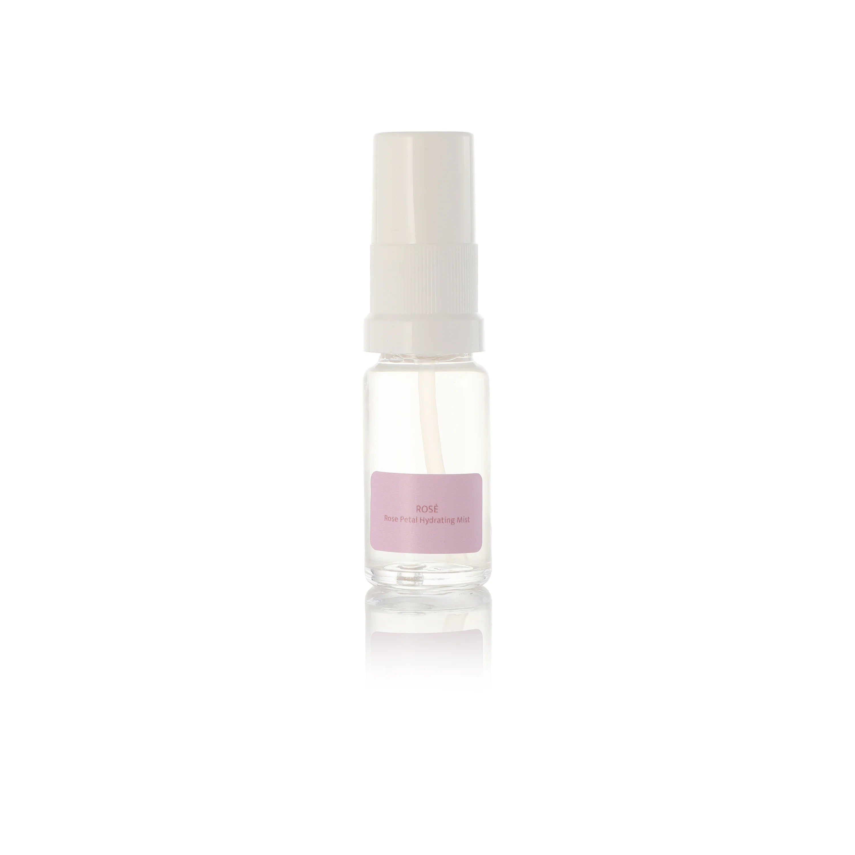 Small glass bottle with a white cap and pink label on a white background rose water face mist NINI Organics