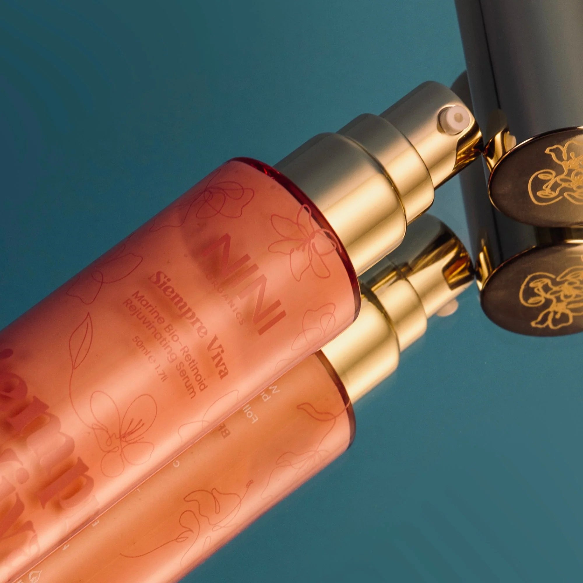Siempre Viva skincare bottles with floral designs on a blue background - NINA Organics skincare