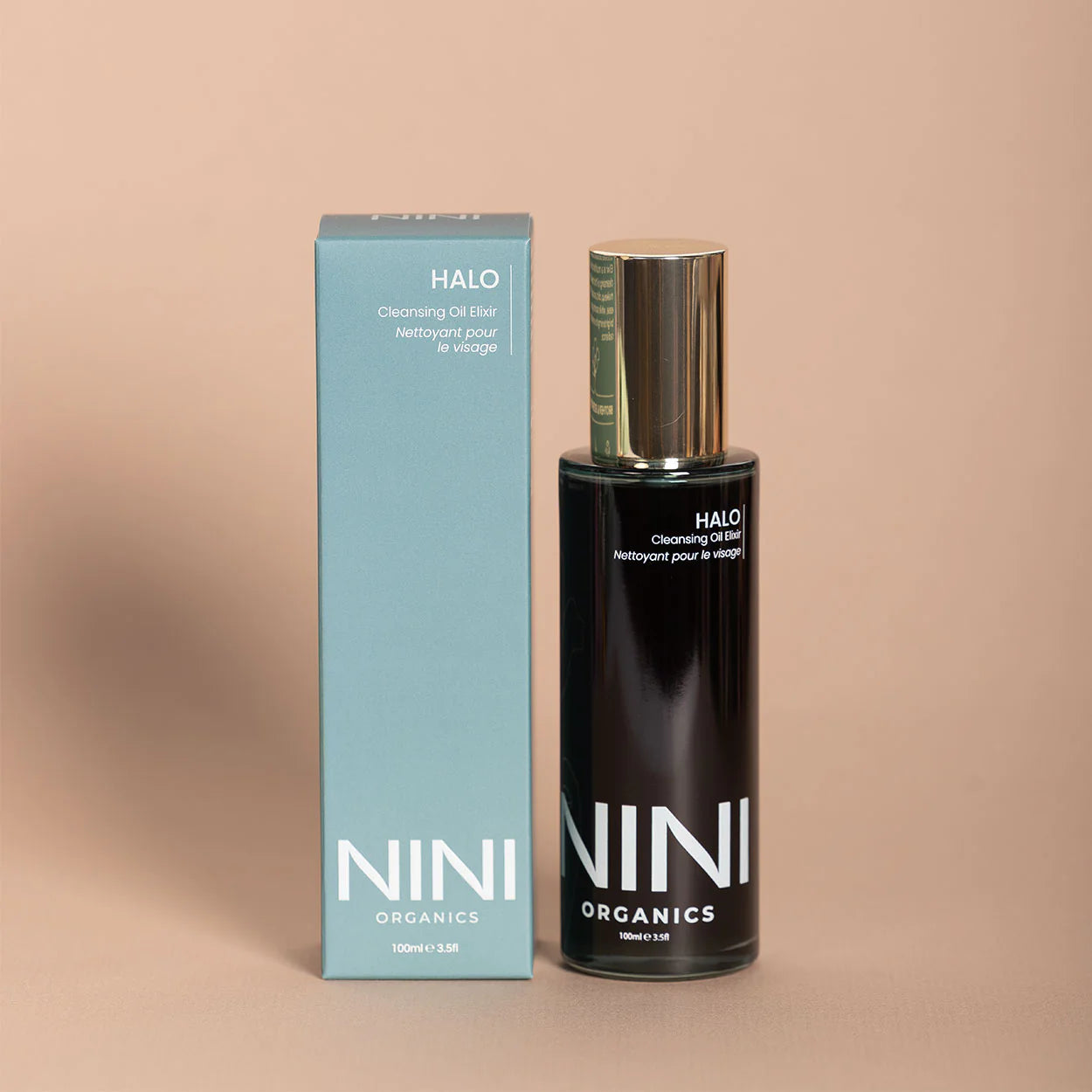 NINI Organics Halo cleansing oil bottle and packaging on a beige background