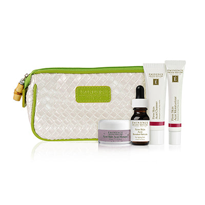 Eminence Organic Firm Skin Starter Set with products on display and a white and green travel bag